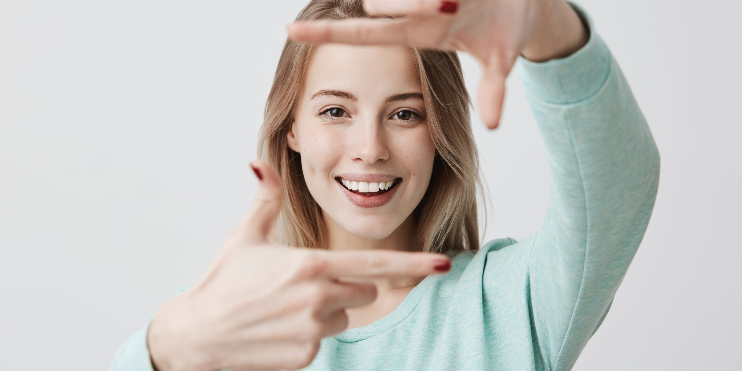 Portrait,Of,Young,Blonde,Positive,Female,With,Cheerful,Expression,,Dressed dentist taylorsville