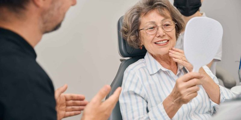 Pensioner,At,A,Dentists,Appointment,Looks,At,Her,Teeth,In restorative dentist taylorsville